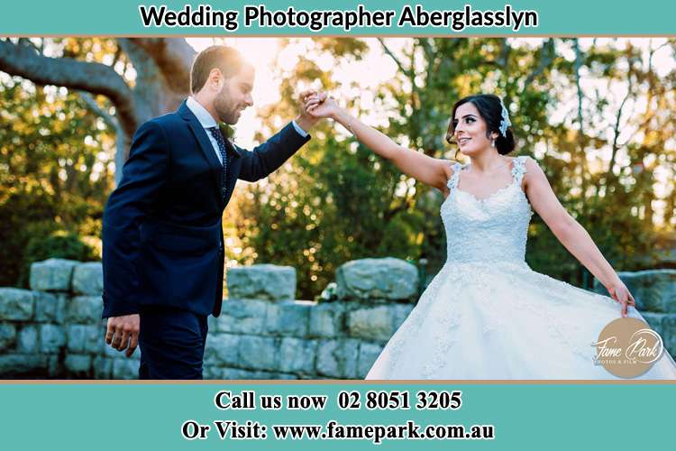 The Groom taking the hand of his Bride Aberglasslyn