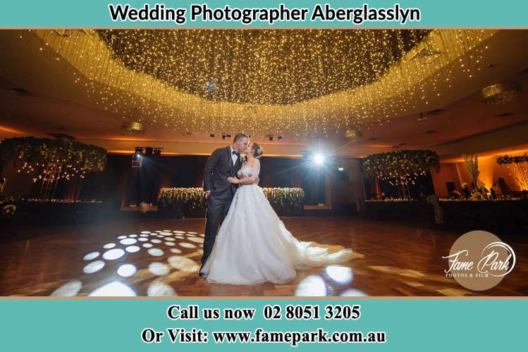 Photo of the Bride and Groom kissing at the dance floor Aberglasslyn