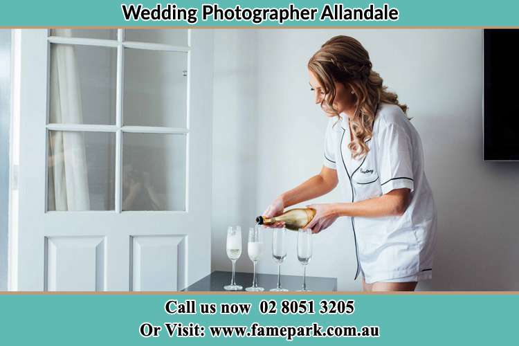 Photo of the Bride pouring wine to the glass Allandale NSW 2320