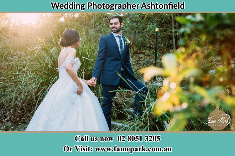 Photo of the Bride and the Groom going up the hill Ashtonfield NSW 2323