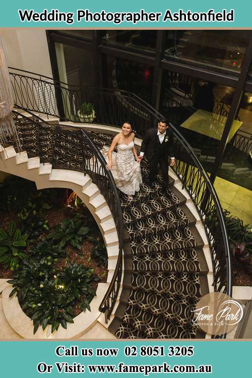 Photo of the Bride and Groom going down the stairs Ashtonfield