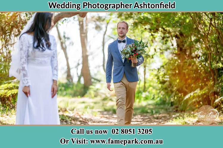 Photo of Groom bringing flower to the Bride Ashtonfield