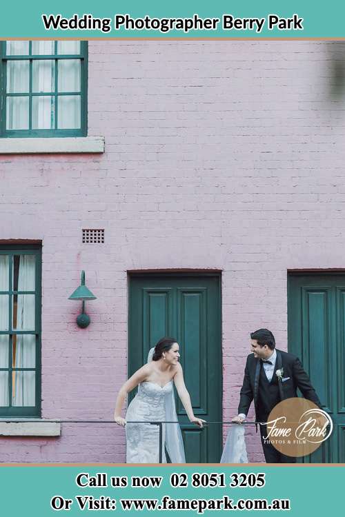 Photo of the Bride and the Groom looking each other at the balcony Berry Park NSW 2321