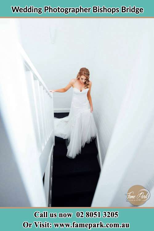 Photo of the Bride going down the stair Bishops Bridge NSW 2326