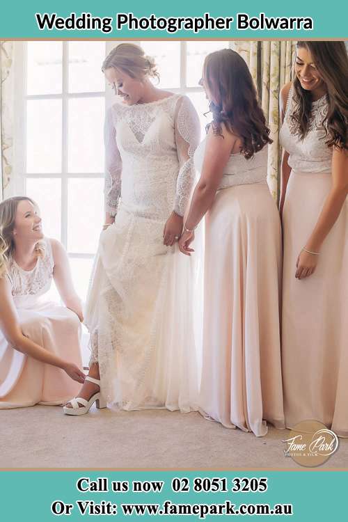 Photo of the Bride with her bridesmaids assisting her Bolwarra NSW 2326