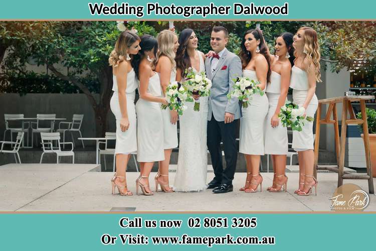 Photo of the Bride and the Groom together with the bridesmaids striking a pose Dalwood NSW 2335