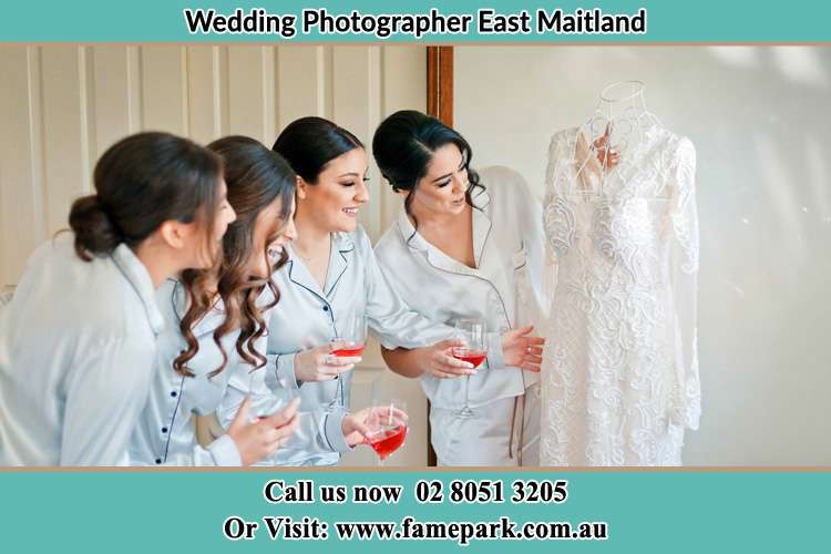 Photo of the Bride and her bridesmaids checking her wedding gown East Maitland NSW 2323