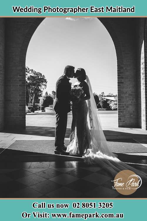 Cinematic photo of the Groom and the Bride kissing East Maitland NSW 2323