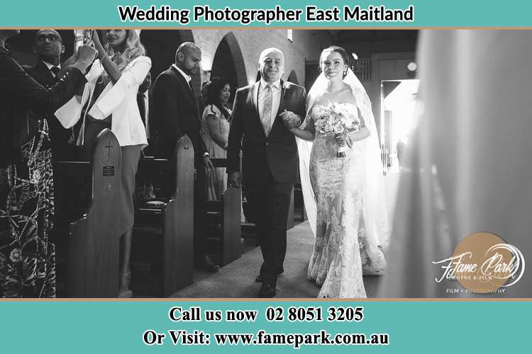 Photo of the Bride accompany by her father walking the aisle East Maitland NSW 2323