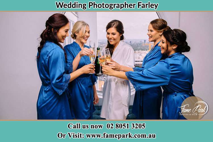 Photo of the Bride together with her bridesmaids having a wine Farley NSW 2320