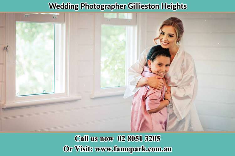 Photo of the Bride hugging her lovely flower girl Gillieston Heights NSW 2321