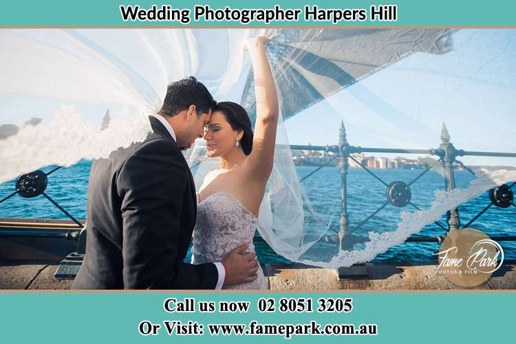 Cinematic photo of the Groom and the Bride kissing Harpers Hill NSW 2321