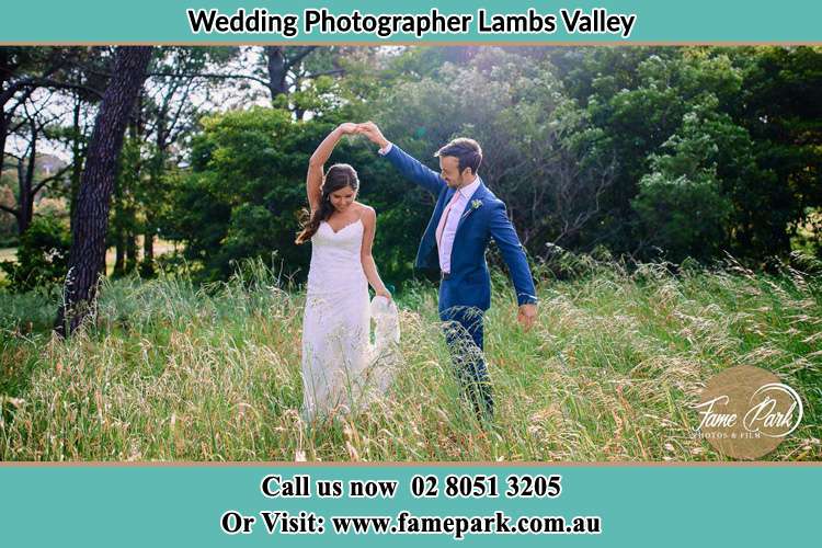 Photo of the Groom and the Bride dancing on the fields Lambs Valley