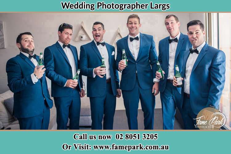 The groom and his groomsmen striking a wacky pose in front of the camera Largs NSW 2320