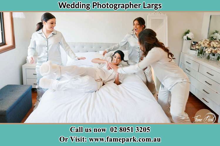 Photo of the Bride and the bridesmaids playing on bed Largs NSW 2320