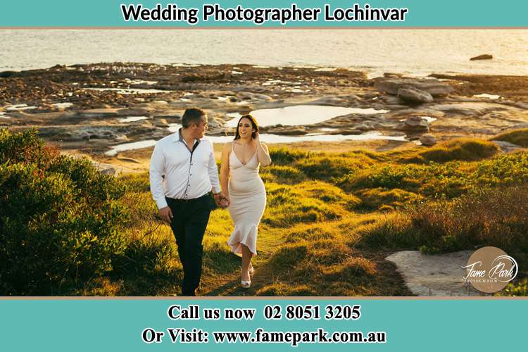 Photo of the Groom and the Bride holding hands while walking Largs NSW 2321