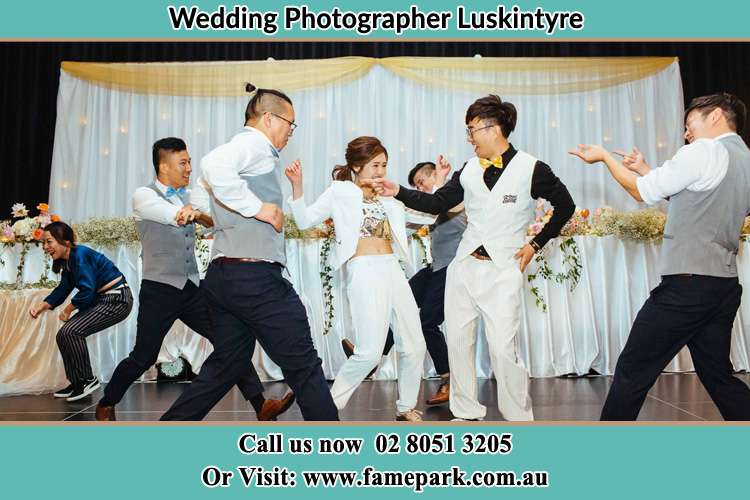 Photo of the Bride and the Groom dancing with the groom men Luskintyre NSW 2321