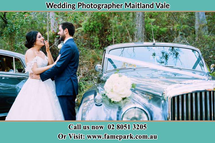 Photo of the Bride and Groom beside the bridal car Maitland Vale