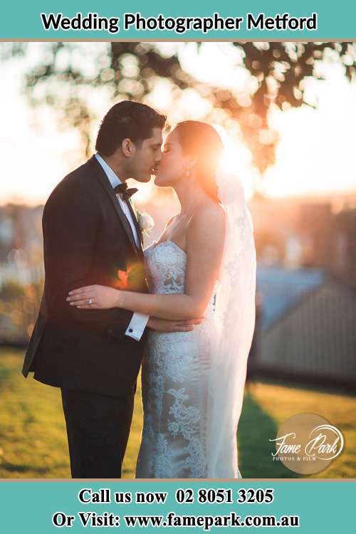 Photo of the Groom and the Bride kissing Metford NSW 2323