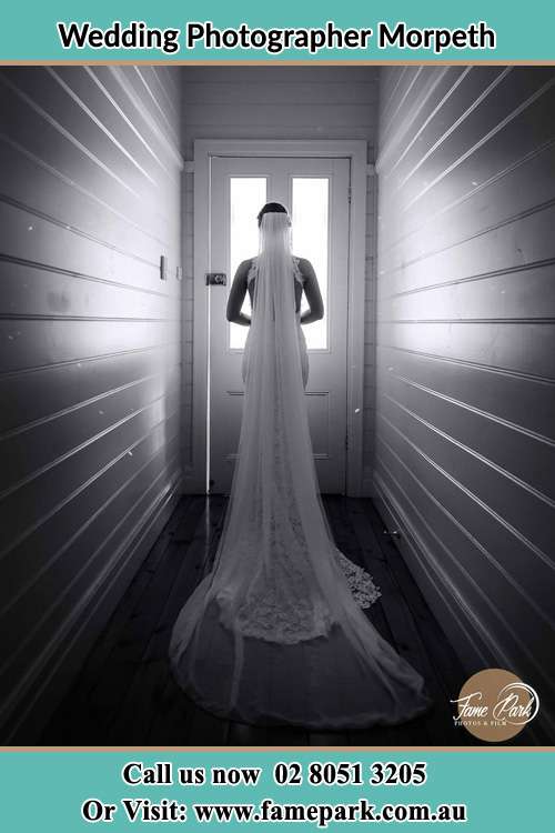 Photo of the Bride waiting for her wedding behind a closed door Morpeth