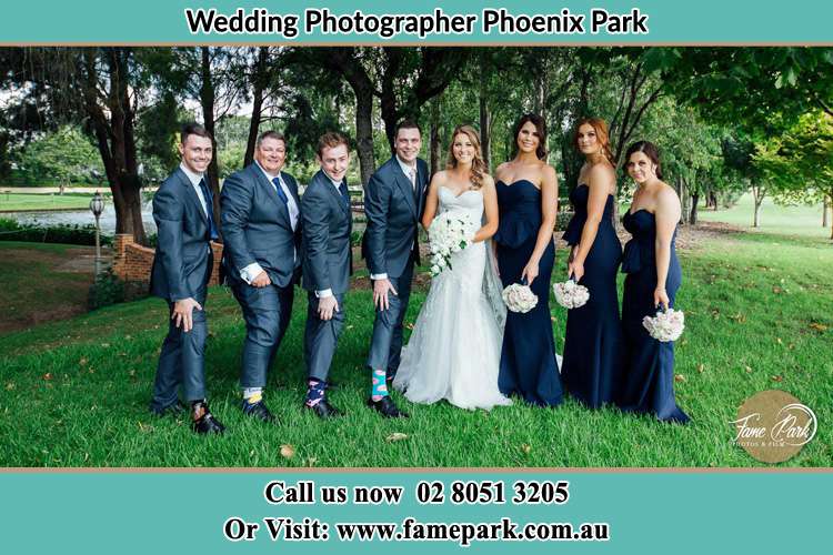 The Bride and the Groom with their entourage pose for the camera Phoenix Park