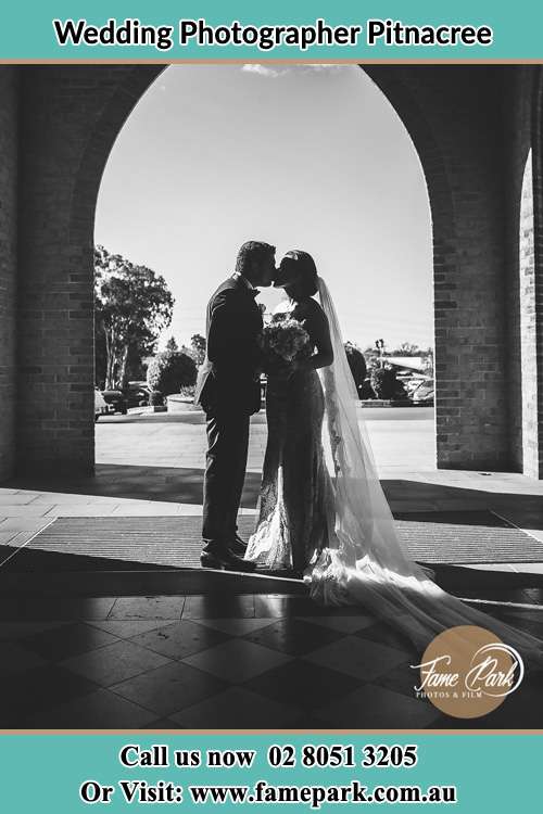 Cinematic photo of the Groom and the Bride kissing Pitnacree NSW 2323