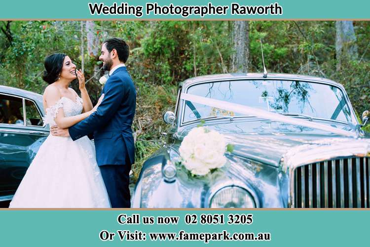 Photo of the Bride and the Groom looking each other outside the car Raworth NSW 2321