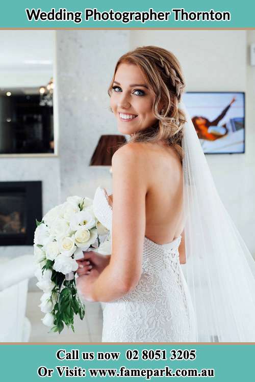 The Bride holding bouquet of flower showing her beautiful smile to the camera Thornton NSW 2322